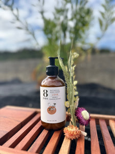 plant-based botanical body wash with rose and sandalwood on outside bath tub